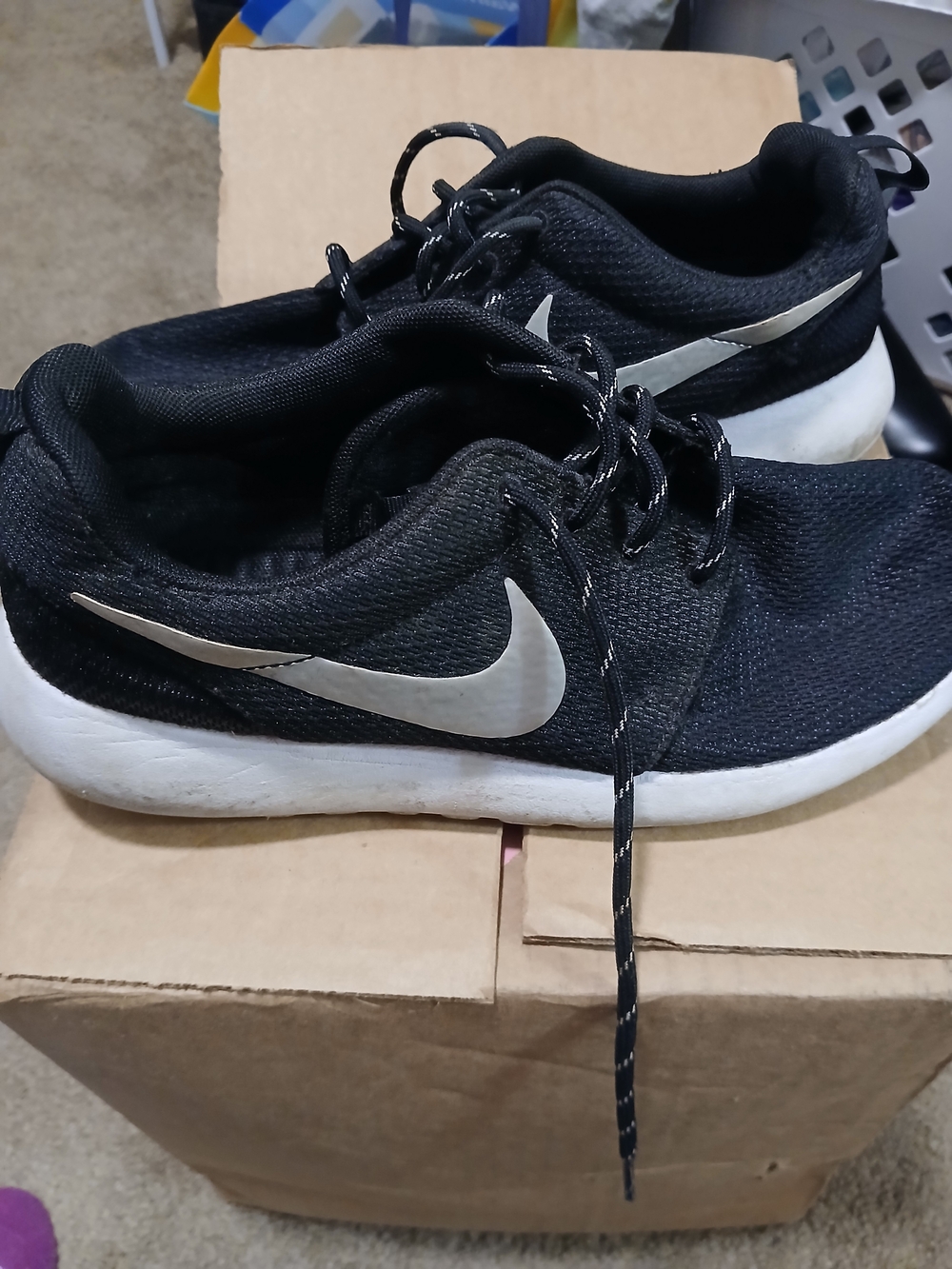 Nike Men’s Black Sneakers with White Swoosh